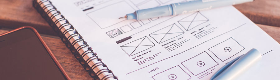 Notebook page with wireframes